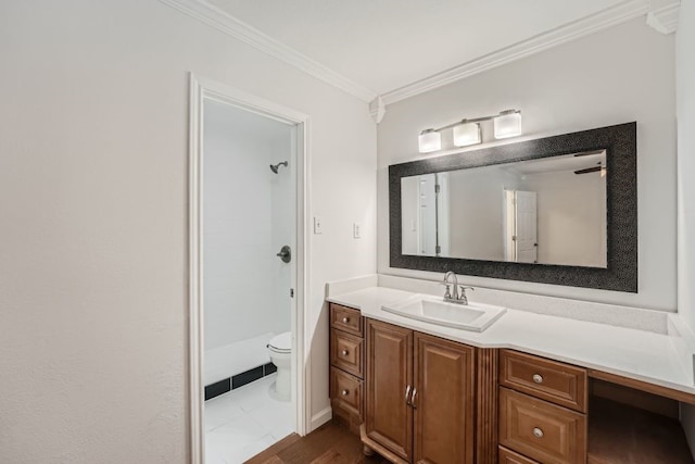 bathroom featuring a shower, vanity, wood-type flooring, ornamental molding, and toilet