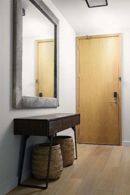 hallway featuring light hardwood / wood-style flooring