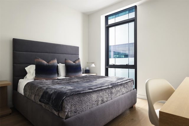 bedroom with wood-type flooring