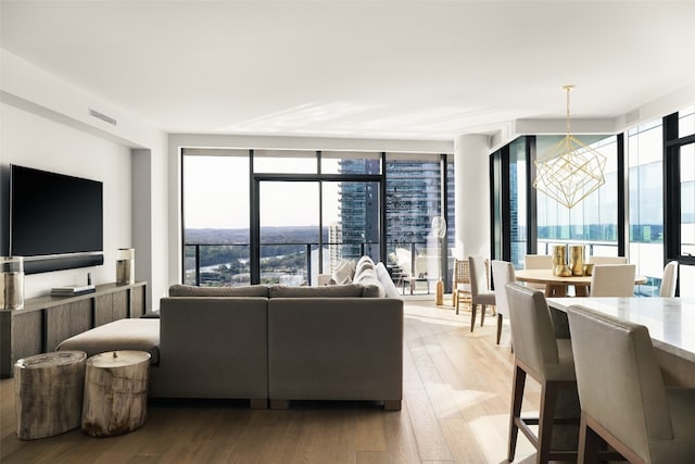 living room featuring hardwood / wood-style floors and floor to ceiling windows