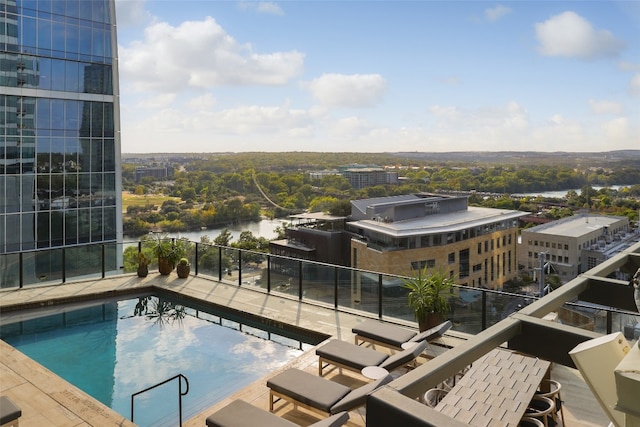 view of pool featuring a water view