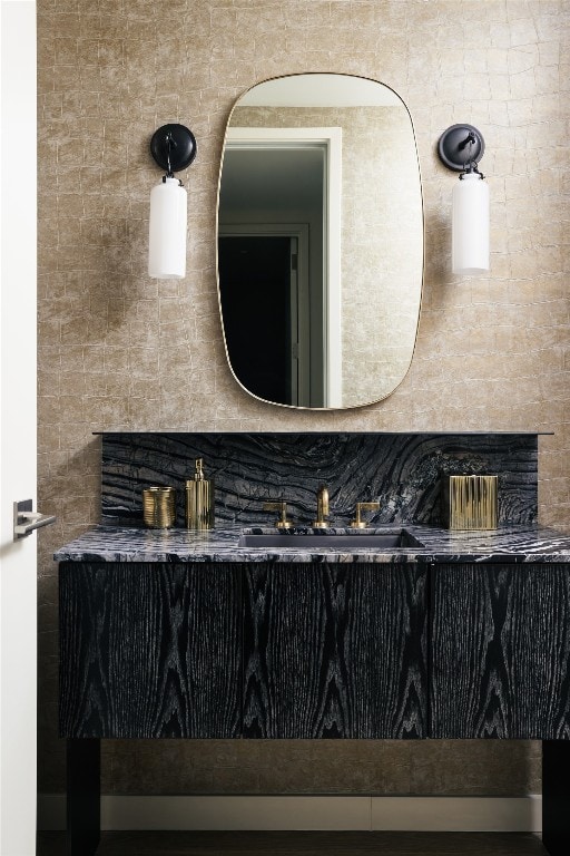 bathroom with decorative backsplash and sink