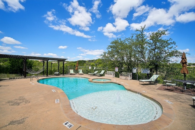 view of pool featuring a community hot tub and a patio