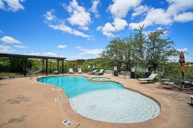 view of pool featuring a pergola, a community hot tub, and a patio