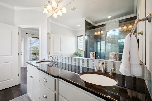 bathroom with vanity, hardwood / wood-style flooring, an enclosed shower, and ornamental molding