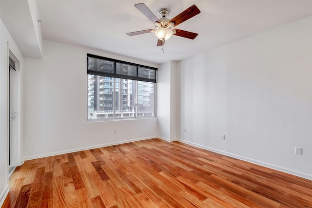 unfurnished room with light hardwood / wood-style floors and ceiling fan