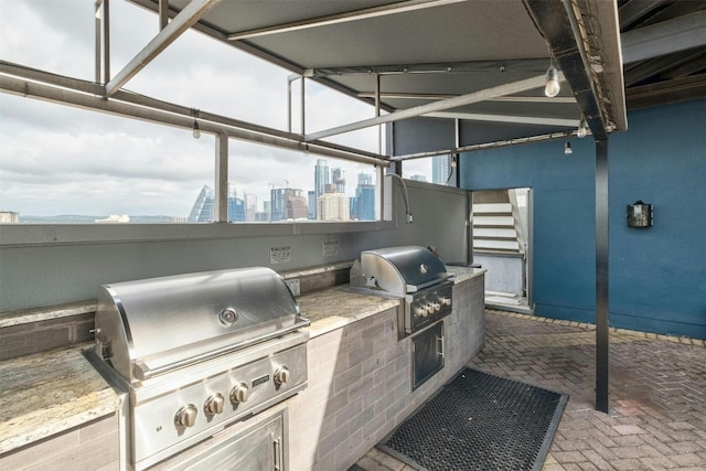 view of patio / terrace featuring area for grilling and a grill