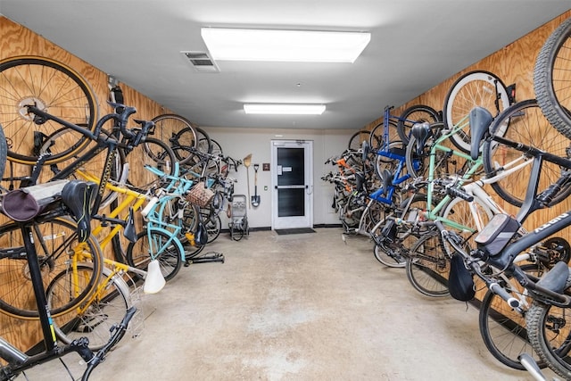 garage featuring wooden walls