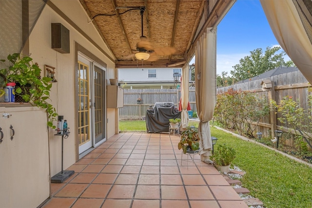 view of patio featuring french doors, area for grilling, and ceiling fan