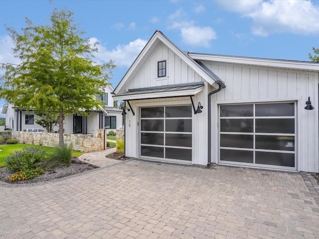 19601 Flying J Blvd Unit 15, Spicewood, TX 78669 - view of front facade with decorative driveway and board and batten siding