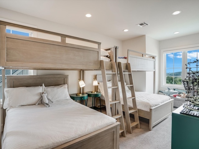 bedroom featuring light carpet