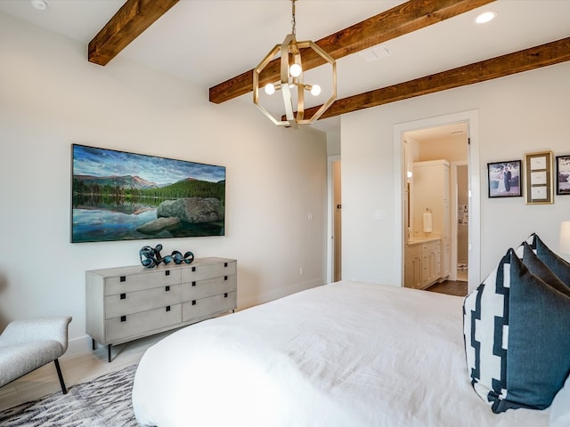 bedroom featuring beam ceiling, a chandelier, ensuite bathroom, and hardwood / wood-style floors