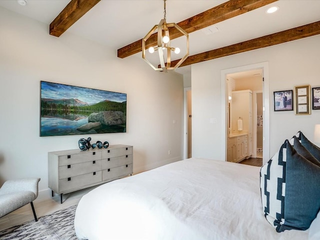19601 Flying J Blvd Unit 15, Spicewood, TX 78669 - bedroom with a chandelier, beam ceiling, wood finished floors, ensuite bathroom, and recessed lighting