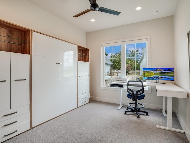 home office featuring ceiling fan and light colored carpet