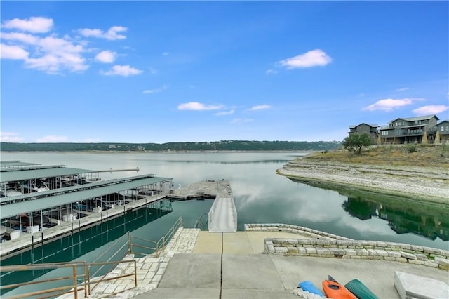 view of pool with a water view