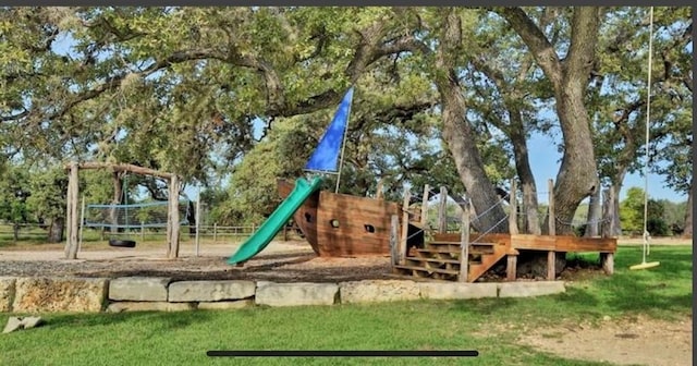 view of playground with a yard