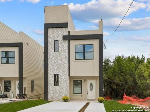 modern home with a front yard