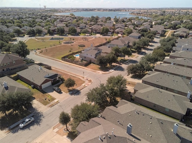 aerial overview of property's location featuring nearby suburban area and a nearby body of water