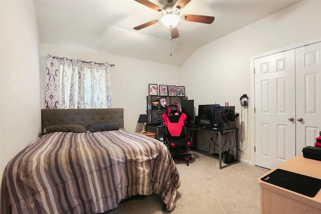 carpeted bedroom featuring vaulted ceiling, a closet, and ceiling fan