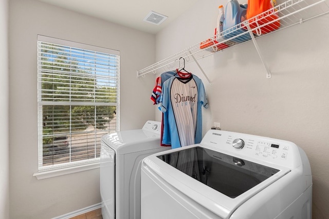 laundry room with independent washer and dryer