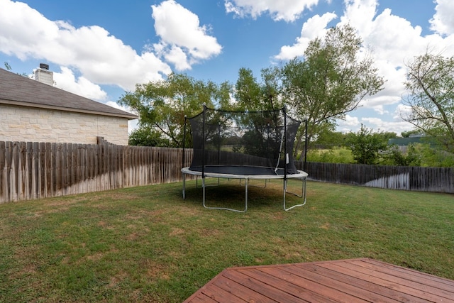 view of yard with a trampoline