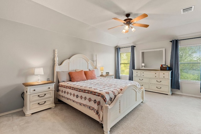 carpeted bedroom featuring ceiling fan and vaulted ceiling