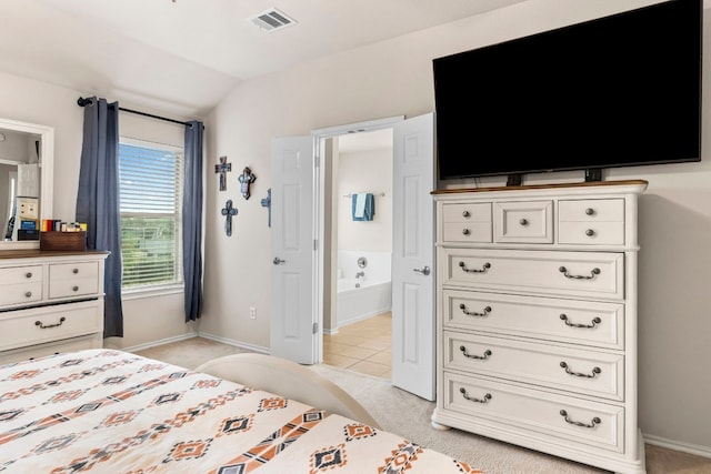 carpeted bedroom with vaulted ceiling