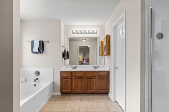 bathroom with tile patterned floors, vanity, and independent shower and bath