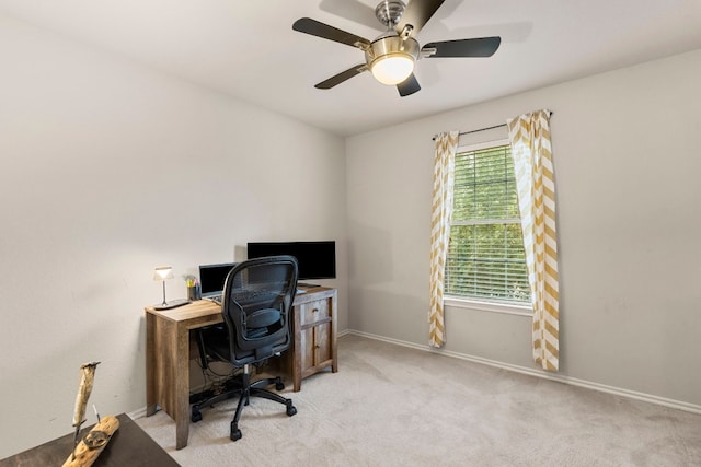 home office with ceiling fan and light colored carpet