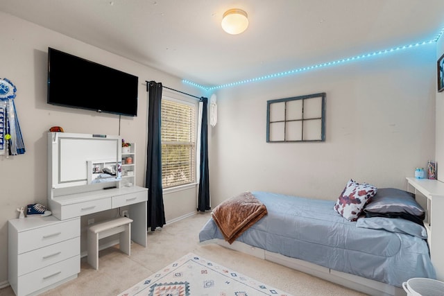 bedroom featuring light colored carpet