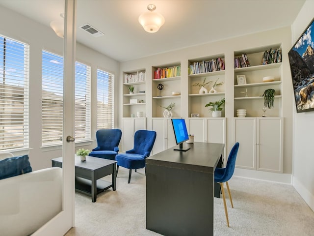 office space with light colored carpet