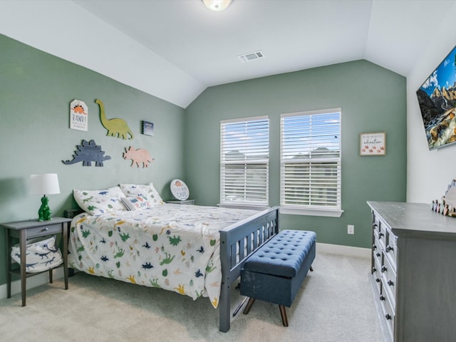 bedroom featuring light carpet and lofted ceiling