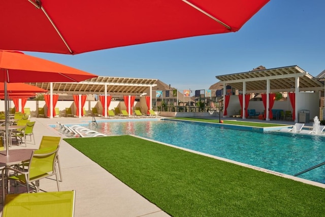 view of swimming pool featuring a patio and a pergola