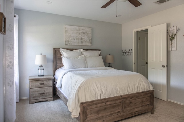 bedroom with ceiling fan and light colored carpet