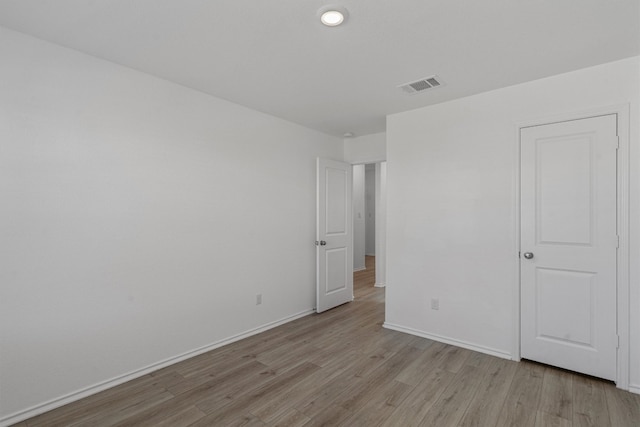 unfurnished room with light hardwood / wood-style floors