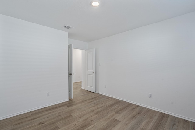 unfurnished room featuring light wood-type flooring