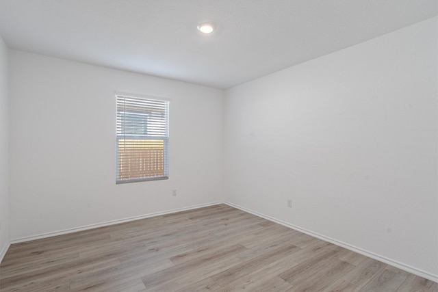 unfurnished room featuring light hardwood / wood-style floors