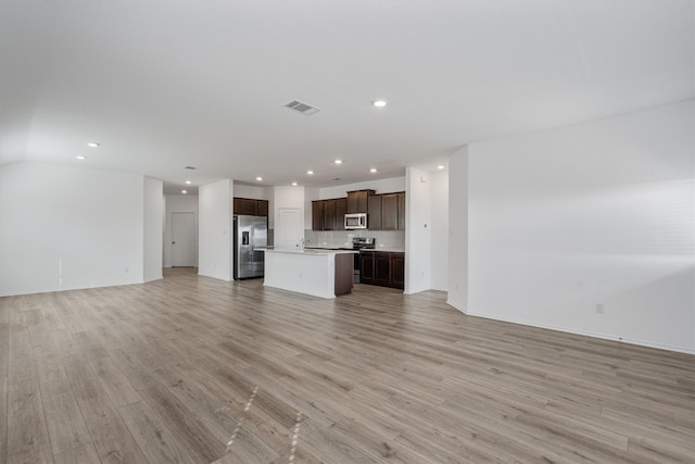 unfurnished living room with light hardwood / wood-style floors