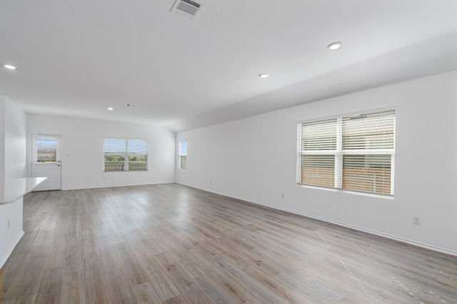 unfurnished room with light wood-type flooring