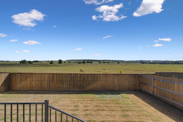 view of yard with a rural view