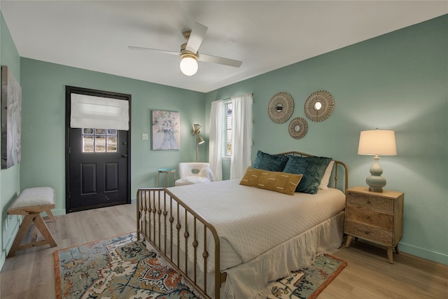 bedroom featuring light hardwood / wood-style floors and ceiling fan