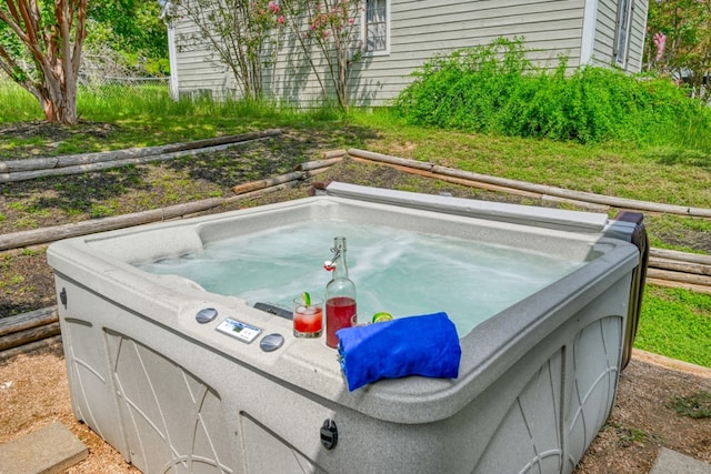 exterior space with a hot tub