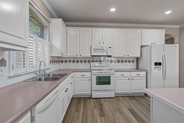 kitchen with light wood-type flooring, white appliances, crown molding, sink, and white cabinets