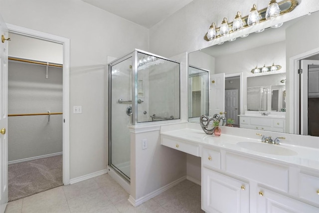 bathroom featuring tile patterned flooring, vanity, and an enclosed shower