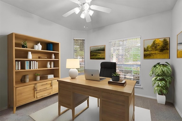 carpeted home office with ceiling fan