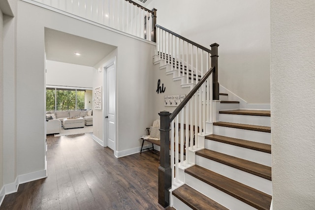 stairs with wood-type flooring