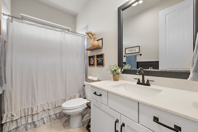 full bathroom with tile patterned flooring, shower / bath combo with shower curtain, vanity, and toilet