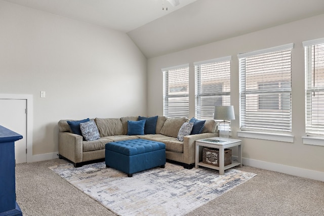 living room with lofted ceiling and carpet floors