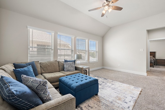 living room with carpet floors, vaulted ceiling, and ceiling fan