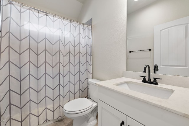 bathroom featuring a shower with curtain, vanity, and toilet